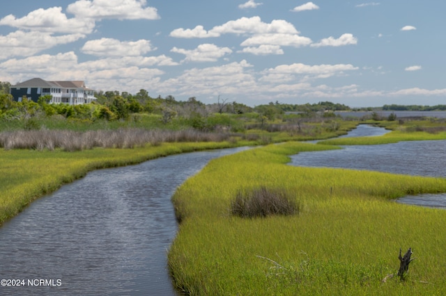 surrounding community with a water view