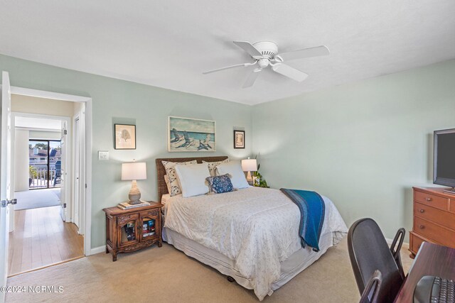 bedroom featuring ceiling fan and light carpet