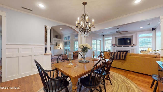 dining room featuring ceiling fan, ornamental molding, and light hardwood / wood-style flooring