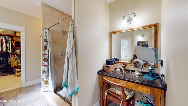 bathroom with crown molding and walk in shower