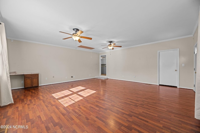 unfurnished room with crown molding, ceiling fan, and dark hardwood / wood-style flooring