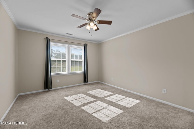 empty room with crown molding, light colored carpet, and ceiling fan