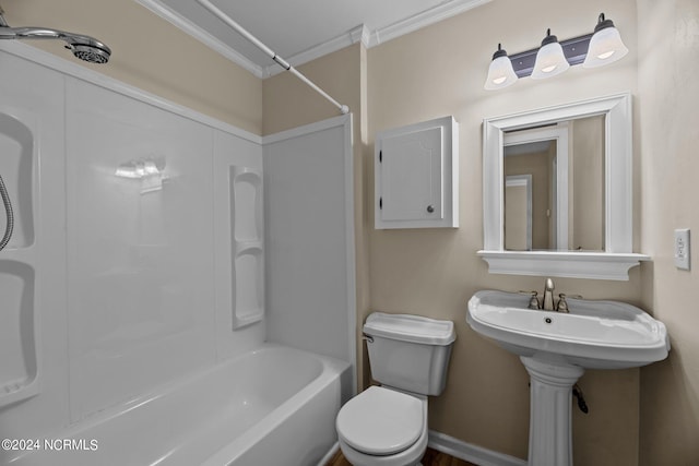 bathroom with toilet, crown molding, and tub / shower combination