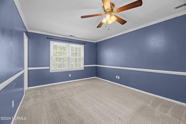 spare room with light carpet, crown molding, and ceiling fan