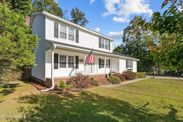 front facade featuring a front yard