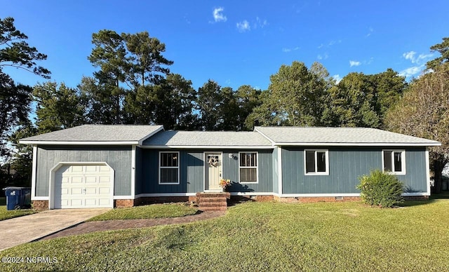 ranch-style home with a front yard and a garage