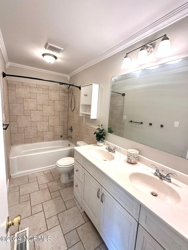 full bathroom featuring tiled shower / bath, vanity, ornamental molding, and toilet