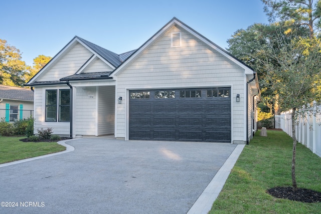 view of front facade featuring a front yard and a garage