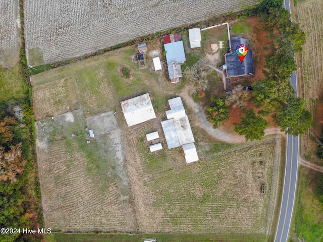 birds eye view of property featuring a rural view