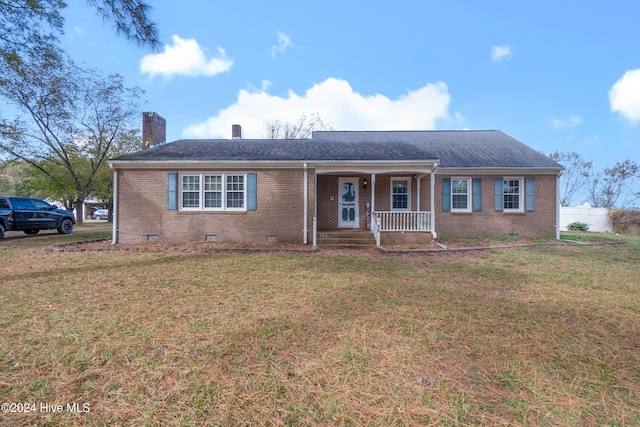 view of front of house with a front yard and a porch