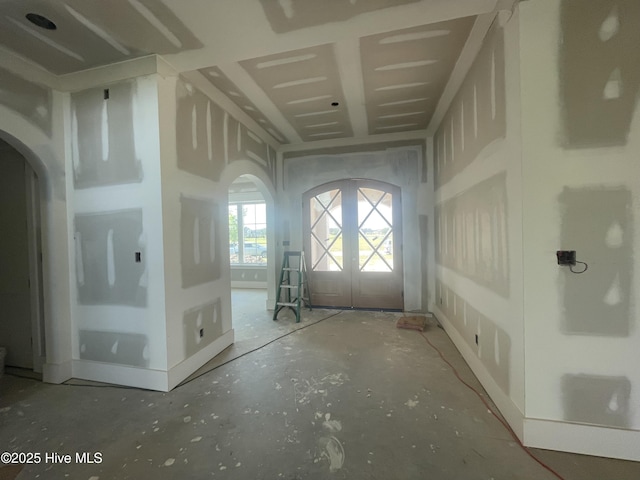 3413 Autumn Breeze Ct, Grimesland, NC 27837 - entryway featuring arched walkways, french doors, and concrete flooring
