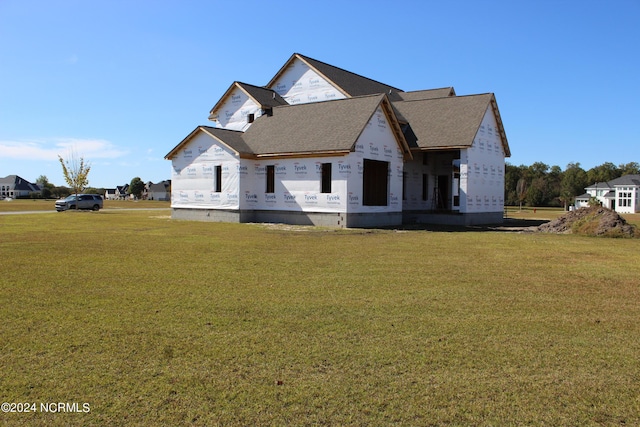 property in mid-construction with a front lawn