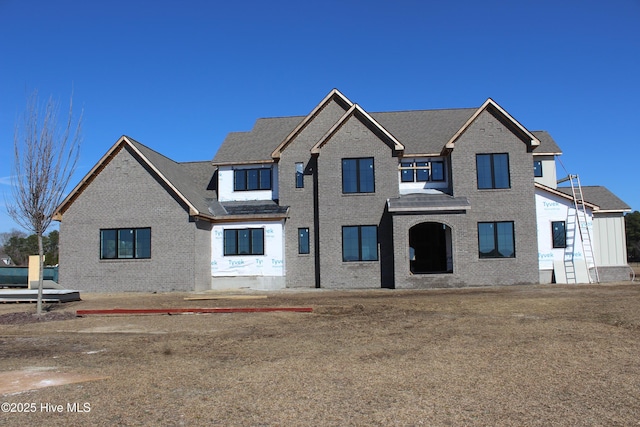 view of front of house with brick siding