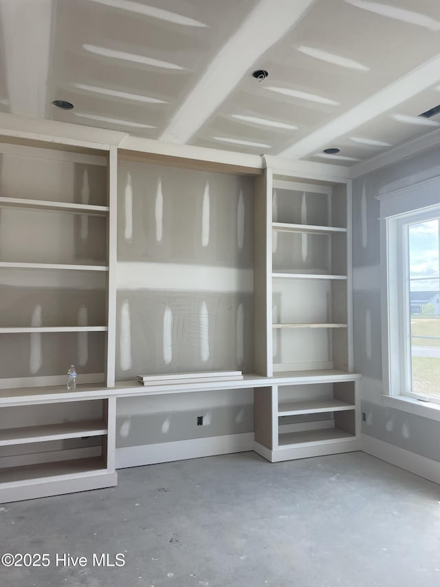 3413 Autumn Breeze Ct, Grimesland, NC 27837 - unfurnished living room with unfinished concrete flooring and baseboards
