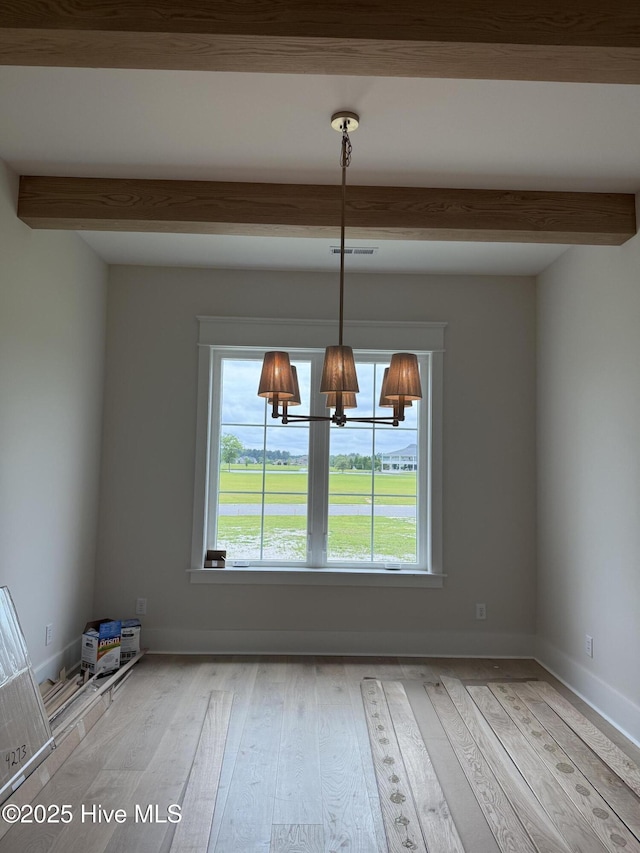 3413 Autumn Breeze Ct, Grimesland, NC 27837 - unfurnished dining area featuring beam ceiling, hardwood / wood-style floors, and a chandelier