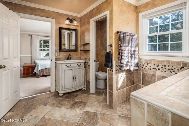 bathroom featuring crown molding, vanity, and toilet