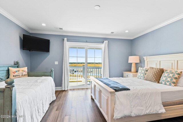 bedroom with access to exterior, dark hardwood / wood-style flooring, and crown molding