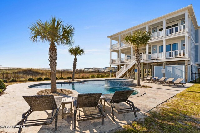 view of swimming pool with a patio