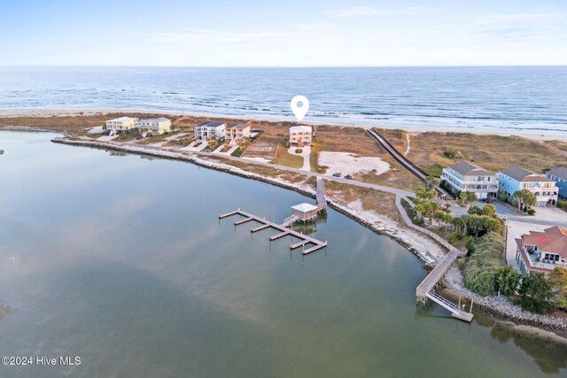 aerial view featuring a water view and a view of the beach