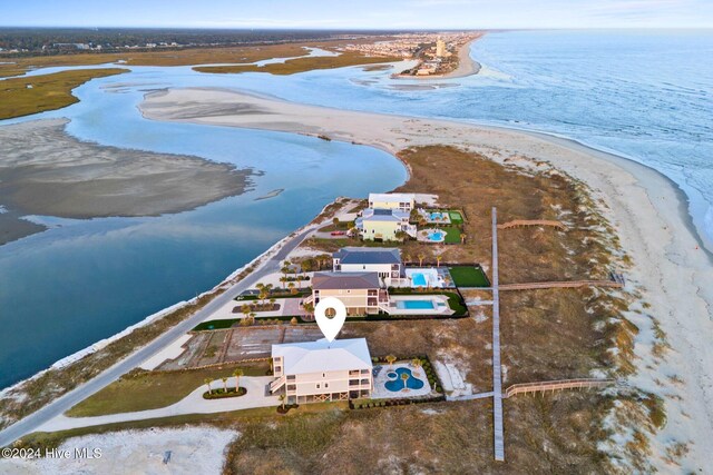 aerial view featuring a view of the beach and a water view