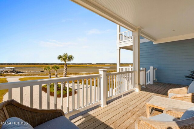 wooden deck with a rural view