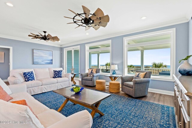 living room featuring ornamental molding, hardwood / wood-style floors, and ceiling fan