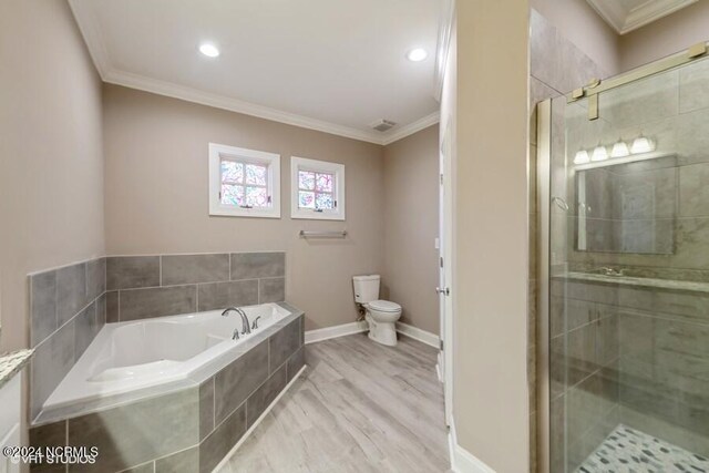 full bathroom featuring toilet, crown molding, hardwood / wood-style flooring, and independent shower and bath