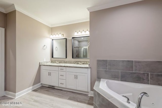 bathroom with vanity, hardwood / wood-style floors, shower with separate bathtub, and crown molding