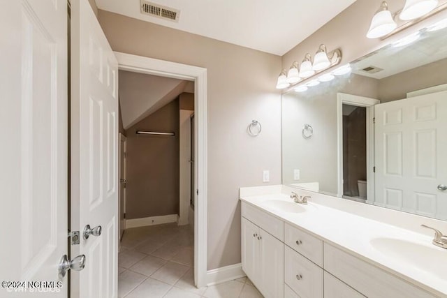 bathroom featuring vanity, toilet, and tile patterned floors