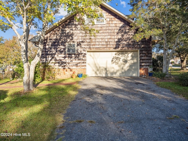 view of side of property with a garage