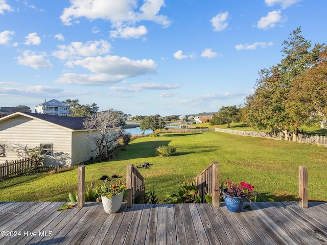 exterior space with a deck with water view