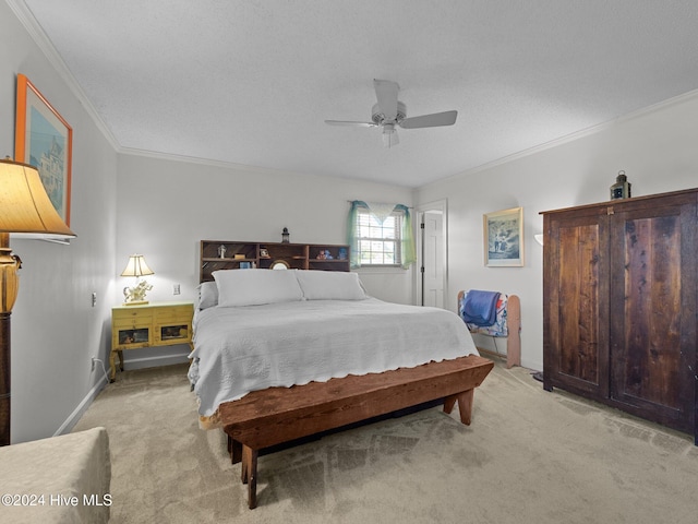 carpeted bedroom featuring ceiling fan, a textured ceiling, and crown molding