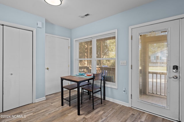 dining room with light wood-type flooring