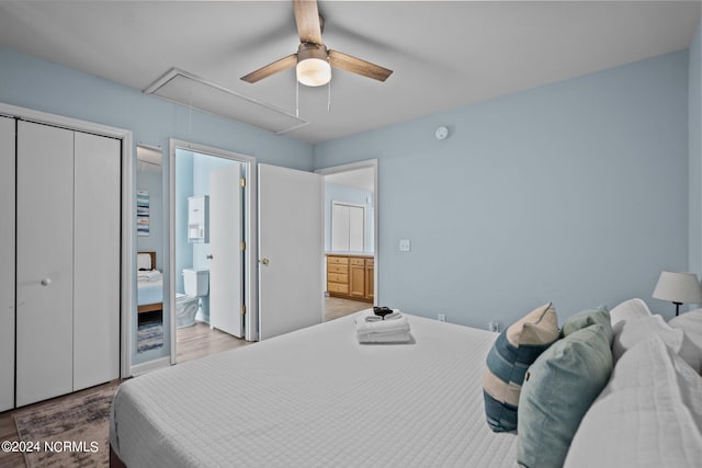 bedroom featuring connected bathroom, hardwood / wood-style flooring, and ceiling fan