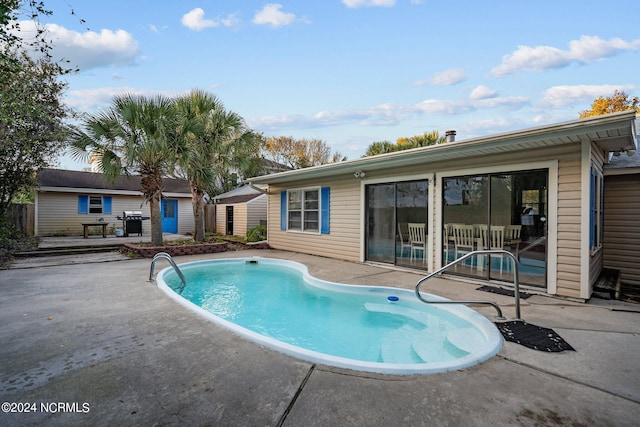 view of pool featuring a patio