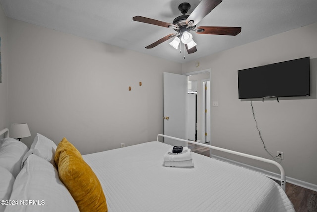 bedroom with wood-type flooring and ceiling fan