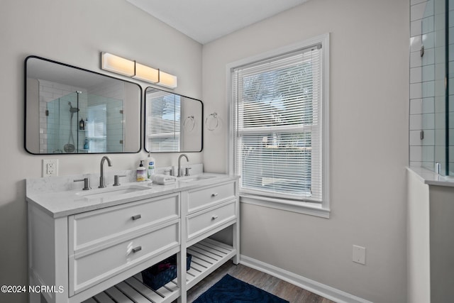 bathroom featuring vanity, hardwood / wood-style floors, and walk in shower