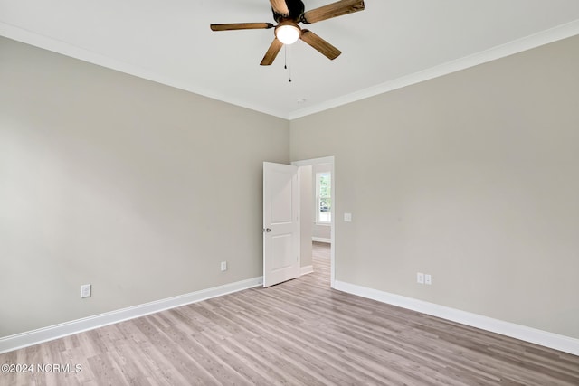 empty room with ornamental molding, light hardwood / wood-style flooring, and ceiling fan