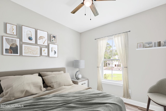 bedroom featuring light hardwood / wood-style floors and ceiling fan