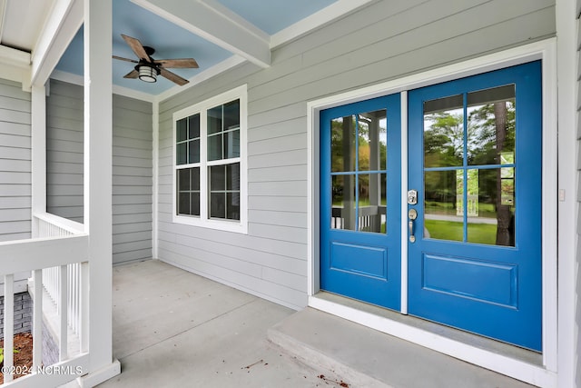 property entrance with french doors and ceiling fan