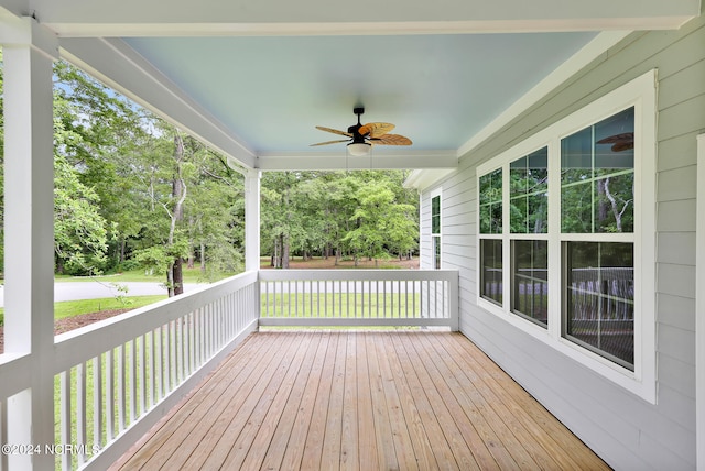 wooden terrace featuring ceiling fan