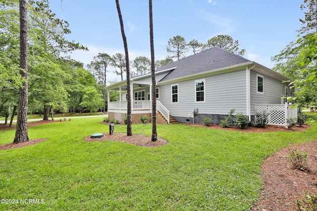 rear view of house with a yard