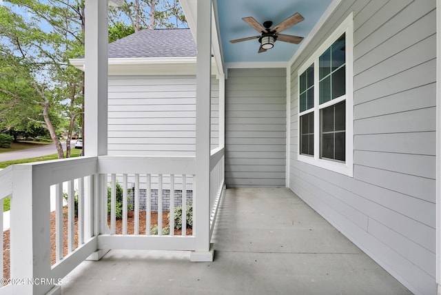 balcony with covered porch and ceiling fan