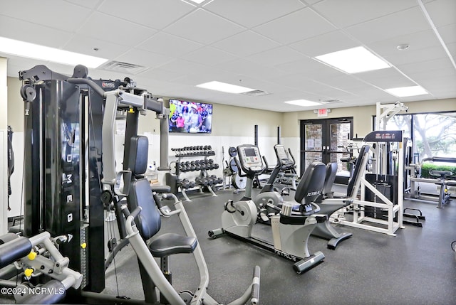 workout area with a paneled ceiling