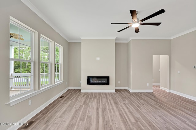 unfurnished living room featuring light hardwood / wood-style floors, crown molding, and ceiling fan