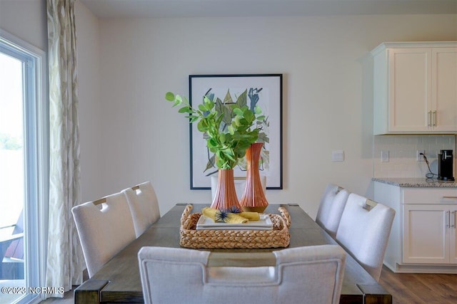 dining area with hardwood / wood-style floors