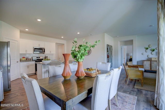 dining room featuring dark wood-type flooring