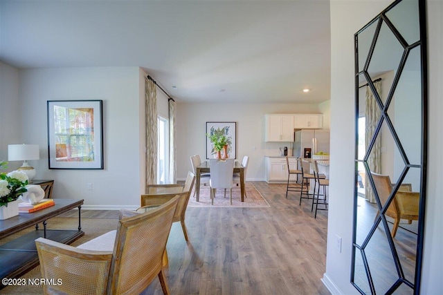 dining room with light wood-type flooring