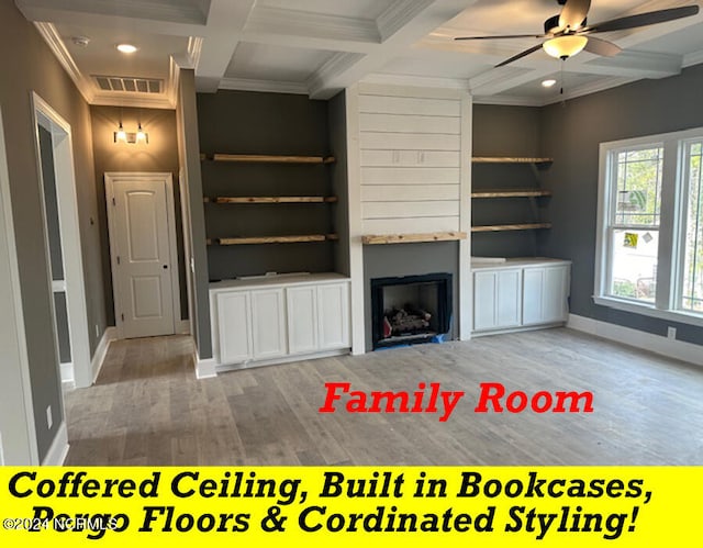 unfurnished living room with ceiling fan, light wood-type flooring, beamed ceiling, a fireplace, and coffered ceiling