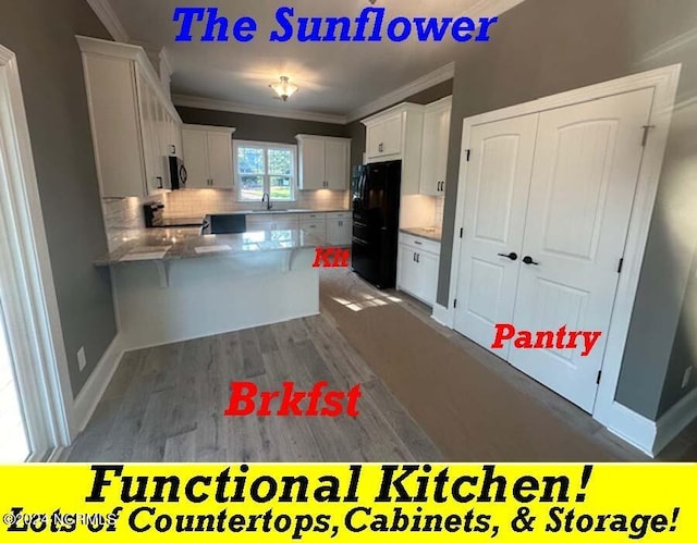 kitchen with kitchen peninsula, backsplash, dark hardwood / wood-style flooring, white cabinetry, and black appliances